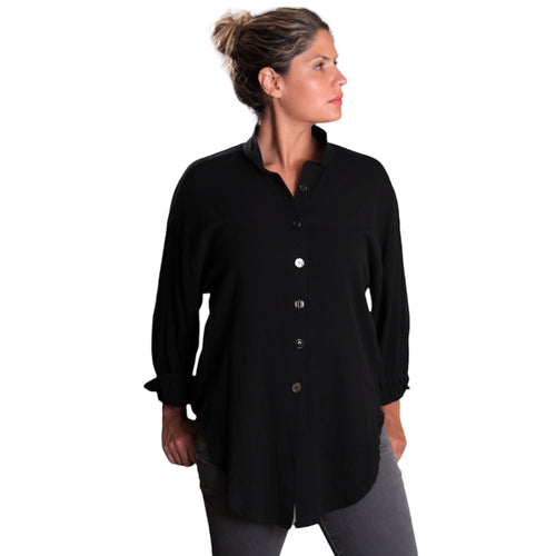 Woman wearing a black button-up shirt on a white background