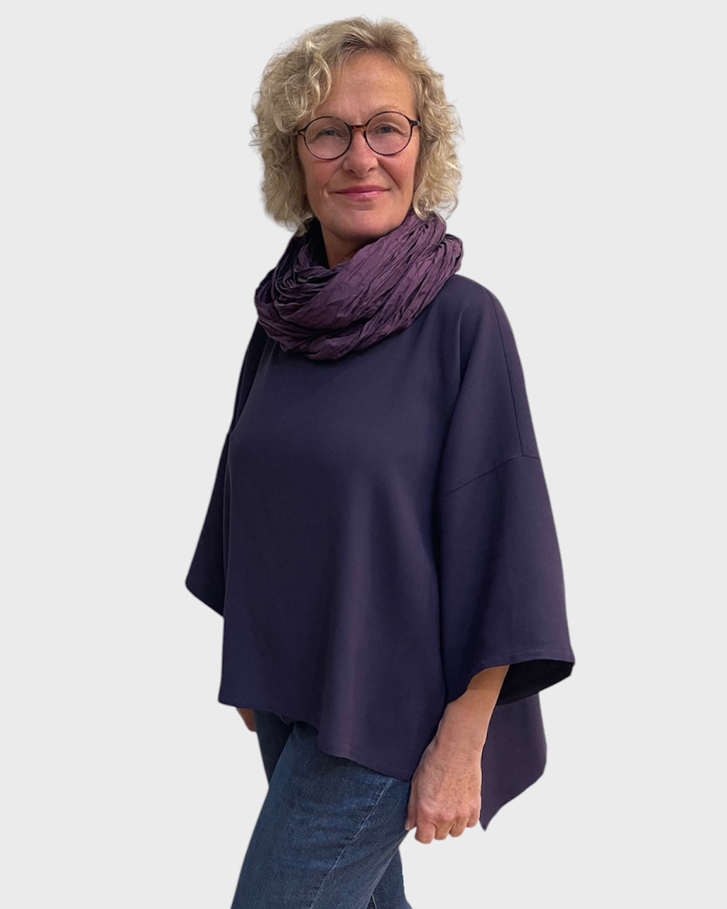 Side view of relaxed fit eggplant cowl neck tunic in wool suiting