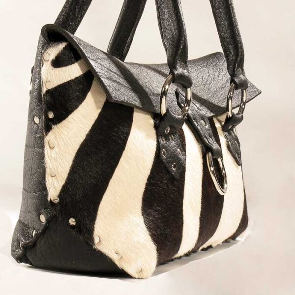 Black white hair on silver riveted purse