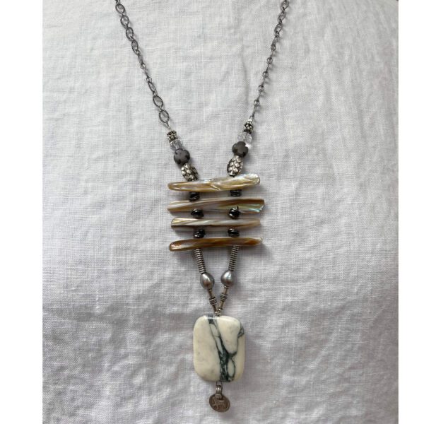 Marble pendant necklace on linen